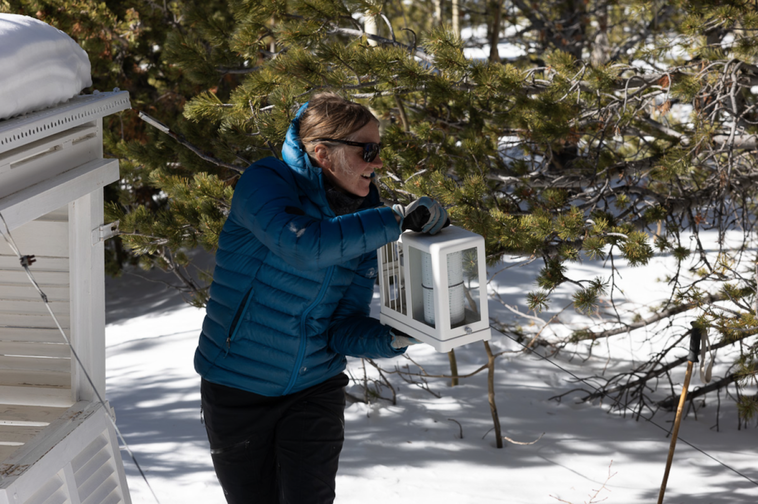 Jen Morse demonstrates a tracking device at Mountain Research Station