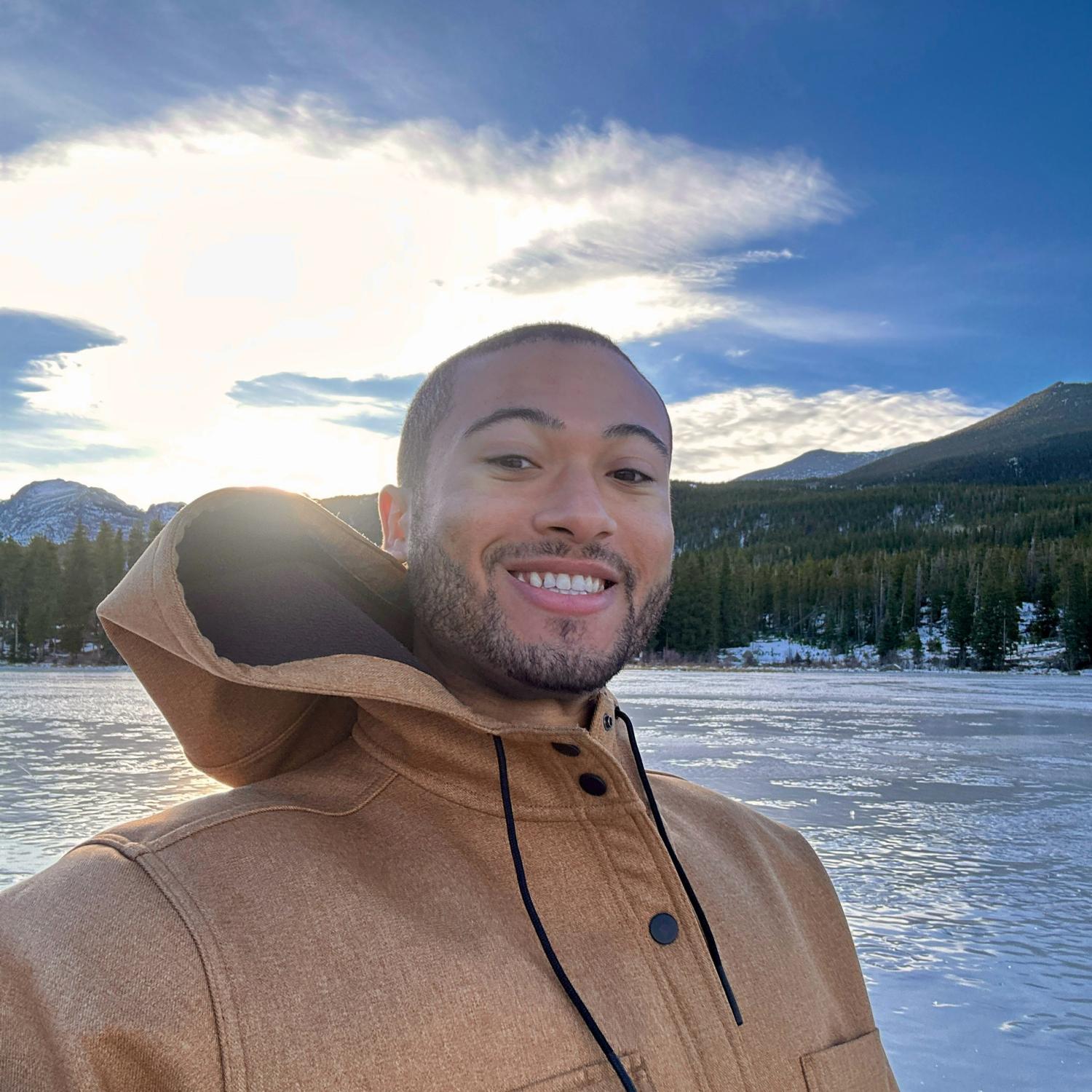 Profile photo of Noah Reardon in front of a mountain