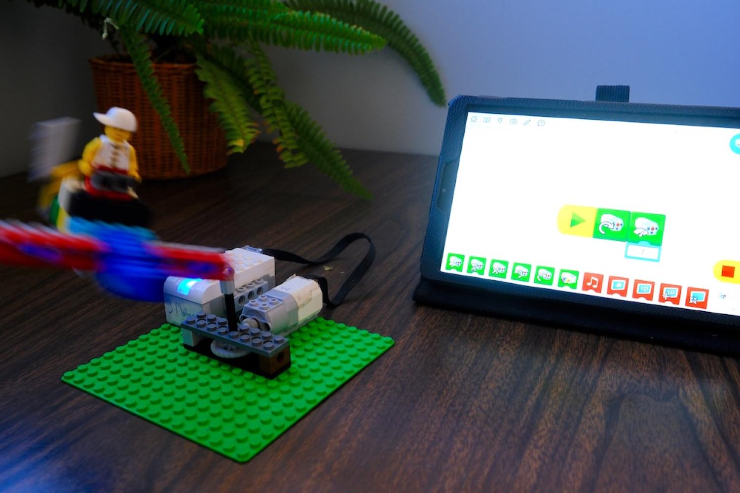 Lego robot airplane in motion with tablet controller