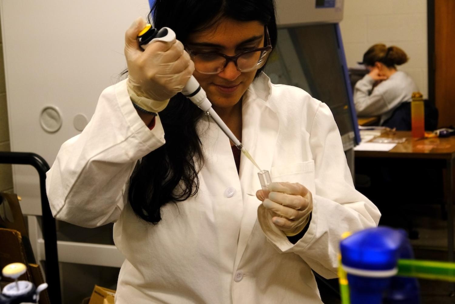 Mirela Alistar in lab coat with equipment