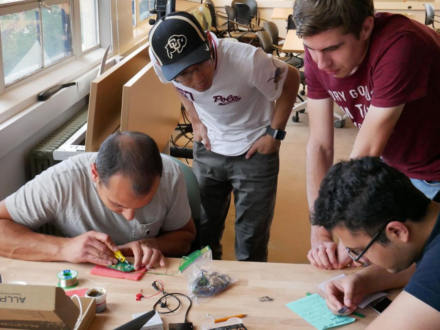 Students working with biochips during the workshop organized by the Living Matter Lab at ATLAS Institute.