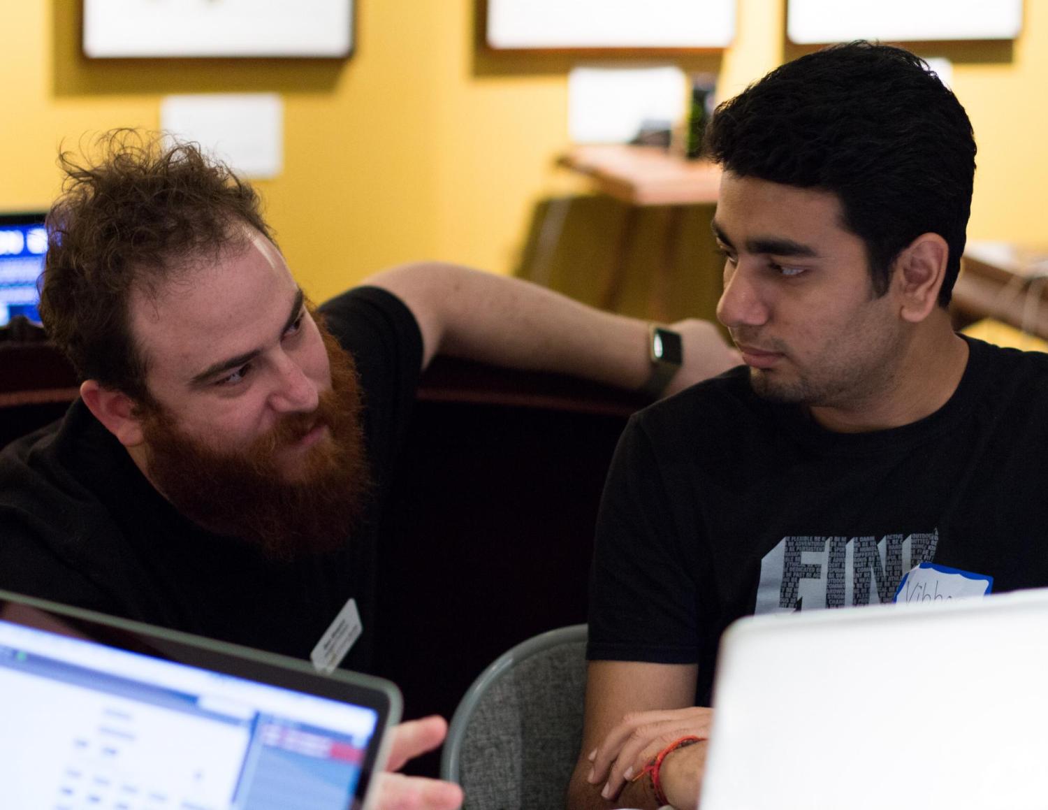 Assistant Professor Ben Shapiro helps a student.