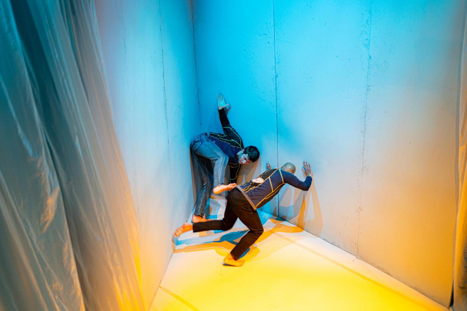 dancers between angled walls