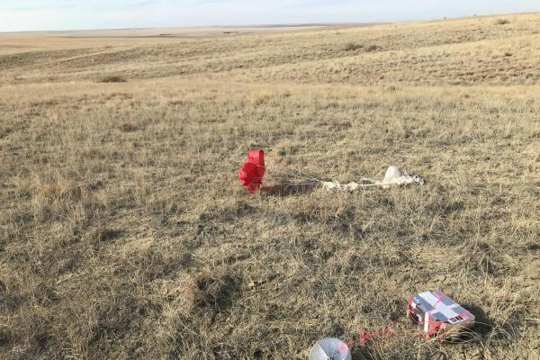 Deflated balloon and flight box after landing