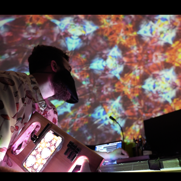 EO Rafelson in front of his Kaleideo project projected at the Fiske Planetarium