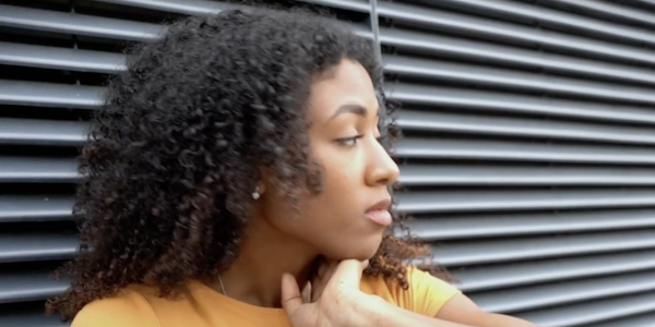 Teenage woman holding her cell phone