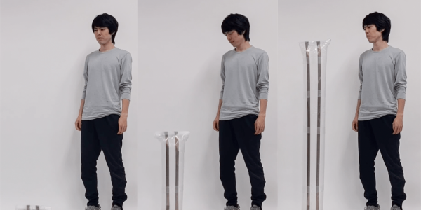 Ryo Suzuki stands next to LiftTiles in three different stages of expansion.