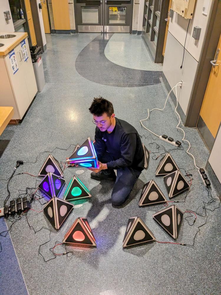 Perry Owens poses with Triangulation components