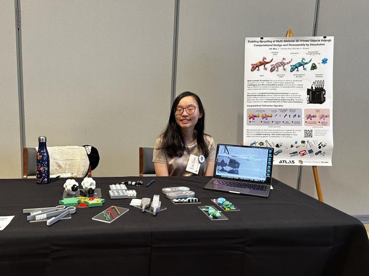 Xin Wen shows off her multi-material recycling project at the Campus Sustainability Summit