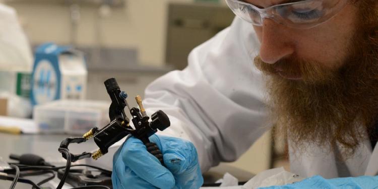 researcher working on tattoo project