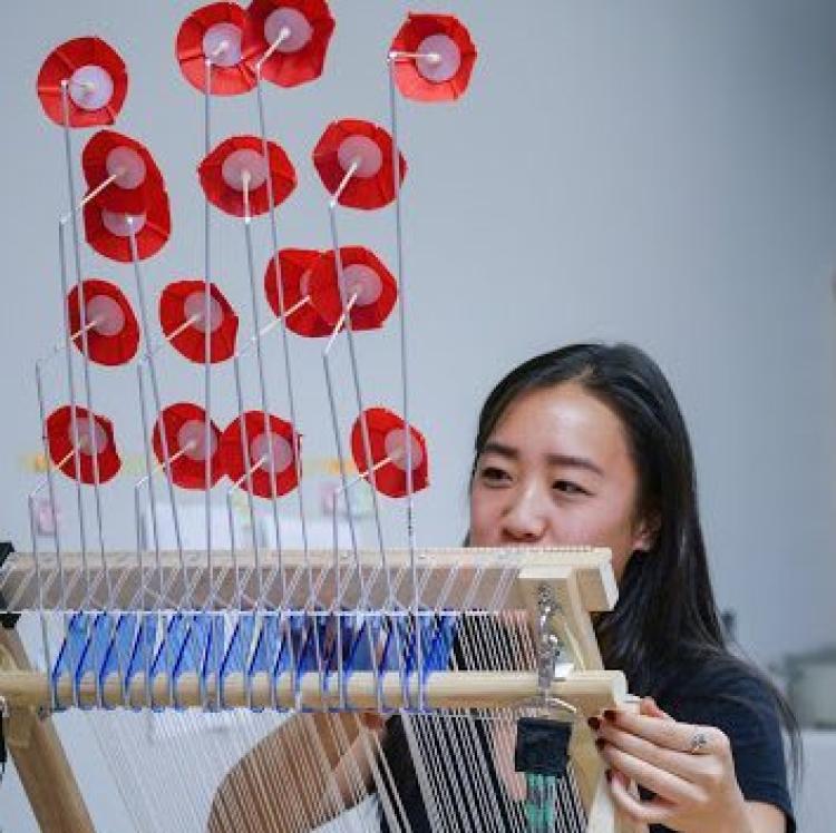 Person using wind loom