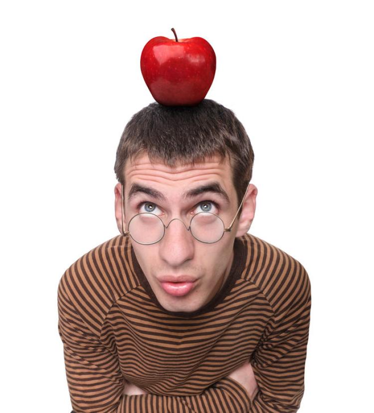 Photo of a man with an apple on his head