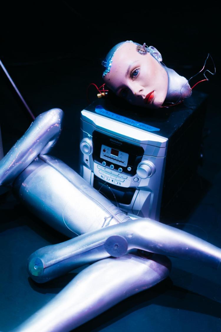 Photo from Overworld performance: mannequin head lying on CD player