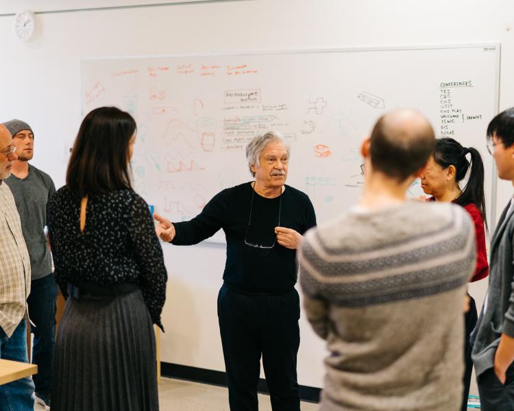 Photo of Alan Kay talking to ATLAS students and faculty