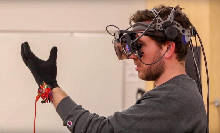 Profile of Aidan with a self-built AR headset on him