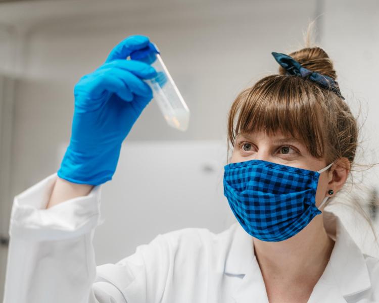 Fiona Bell inspects nanocoating in test tube