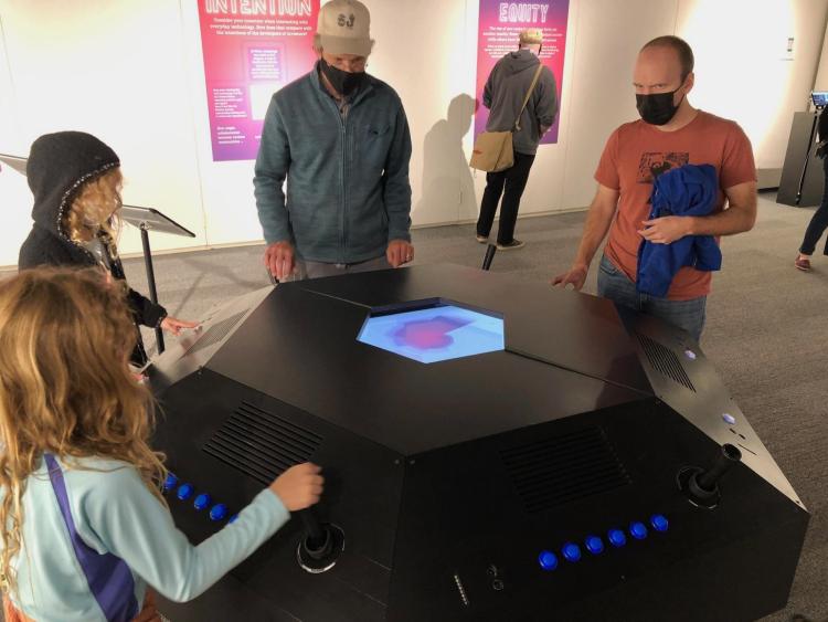 Museum visitors interact with Gallagher's Ghost exhibit