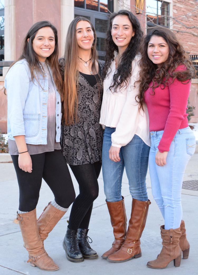 four female BS TAM graduates standing together