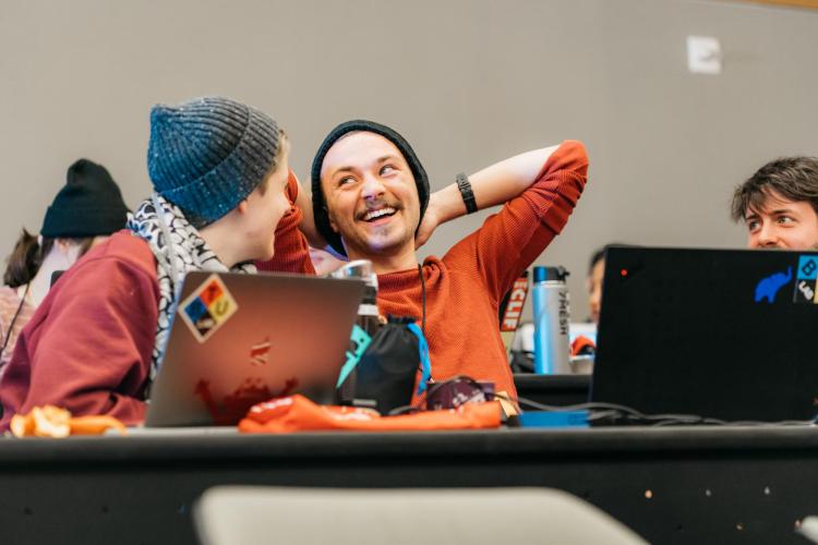 Alex Fiel enjoys a laugh with TAM student Anna Lynton.