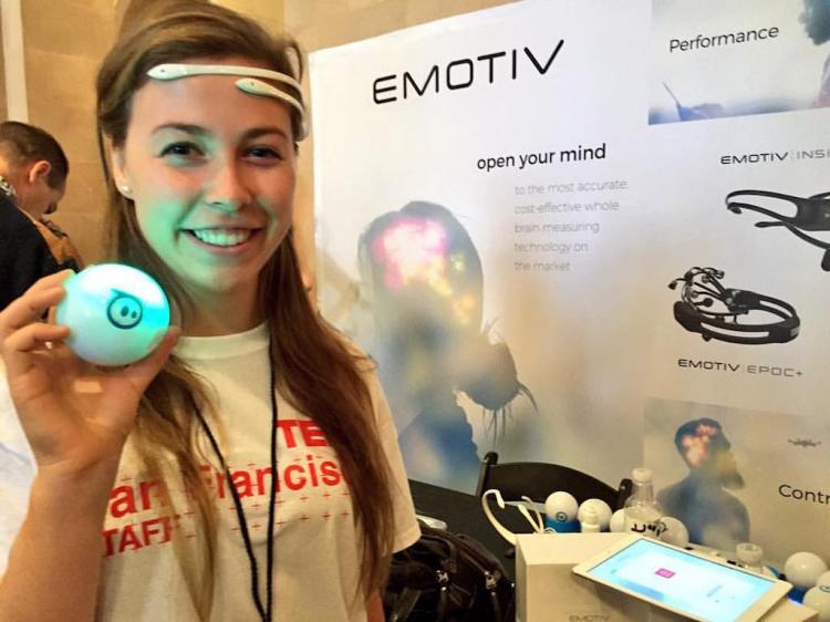 Hayley Liebson at TEDx San Francisco in front of an EMOTIV sign.