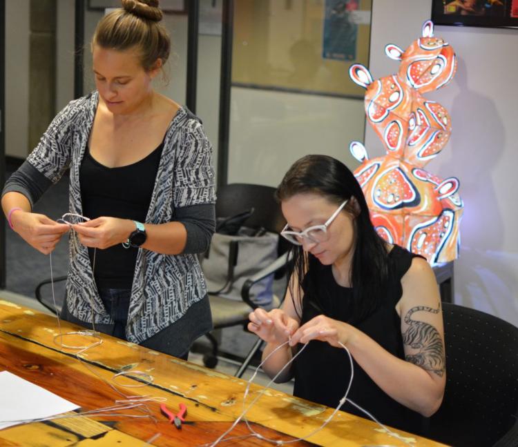 Teachers working with wire