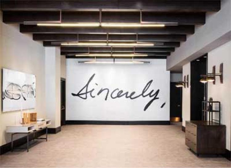 Art exhibit at the Halcyon by Joel Swanson which reads "sincerely"
