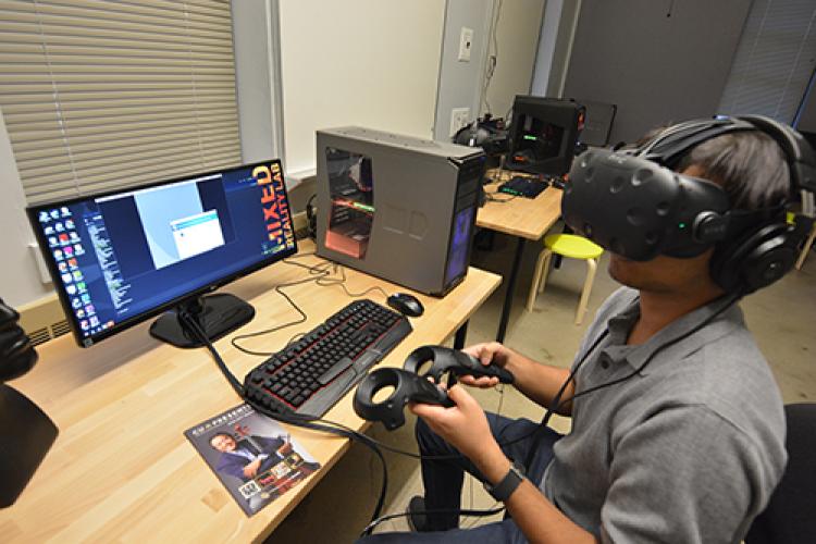 Student uses Virtual reality headset in the new Mixed Reality Lab