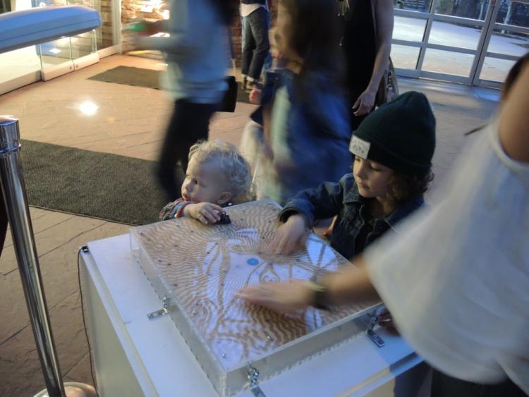 Children play with light sensor