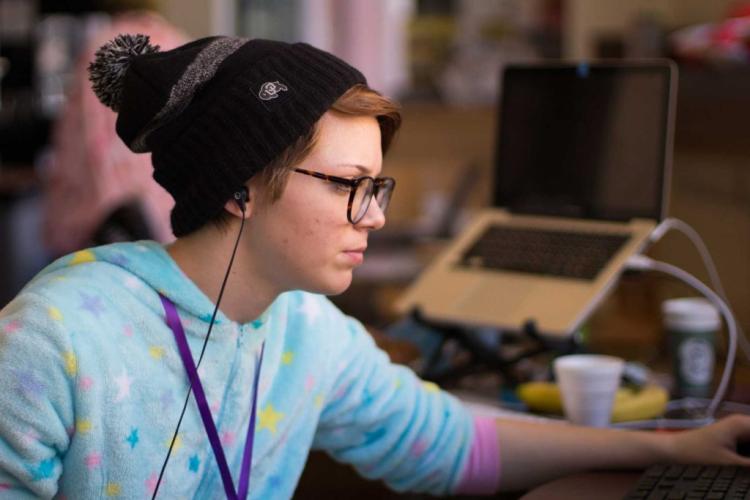 Hacker working on their project in onesie pajamas