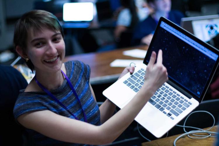 Woman showing her work at T9Hacks