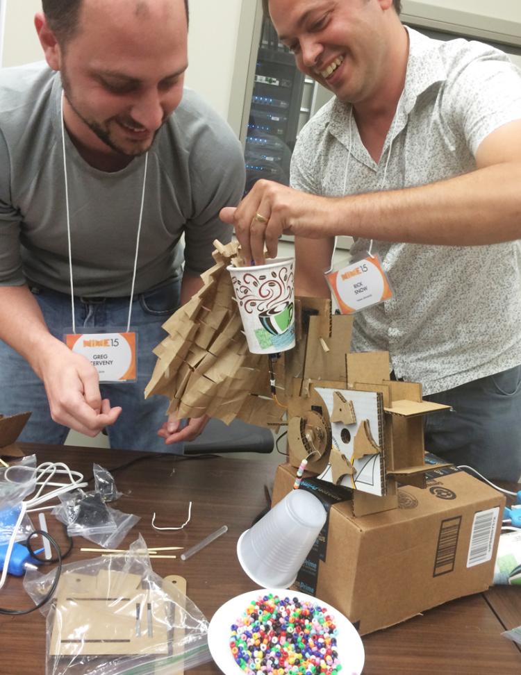 Two men working together on their project