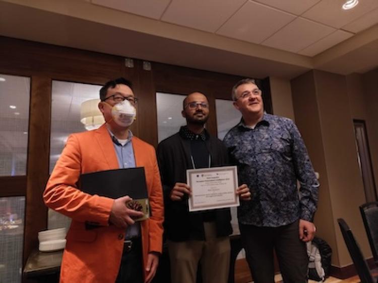 Rishi Vanukuru receives his award certificate