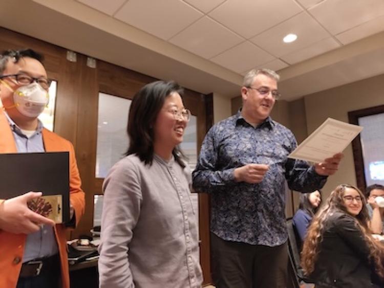 Ada Zhao receives her award certificate