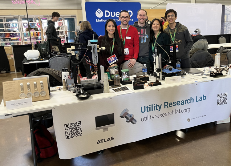 Utility Research Lab team at their table at RMRRF