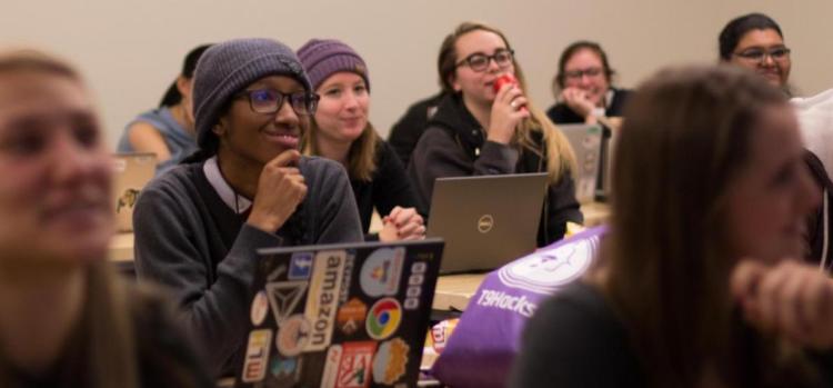 Participants of T9Hacks listen to instructions.