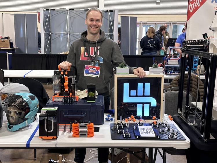 Will Harris standing at his table at RMRRF