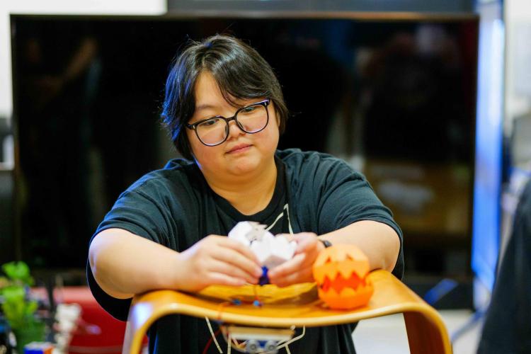 ATLAS student tests out paper robot