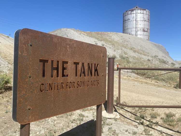 tank image with metal sign in foreground