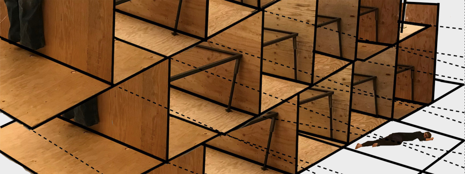 Photo of performer dancing on the floor in front of large wooden gri structure 