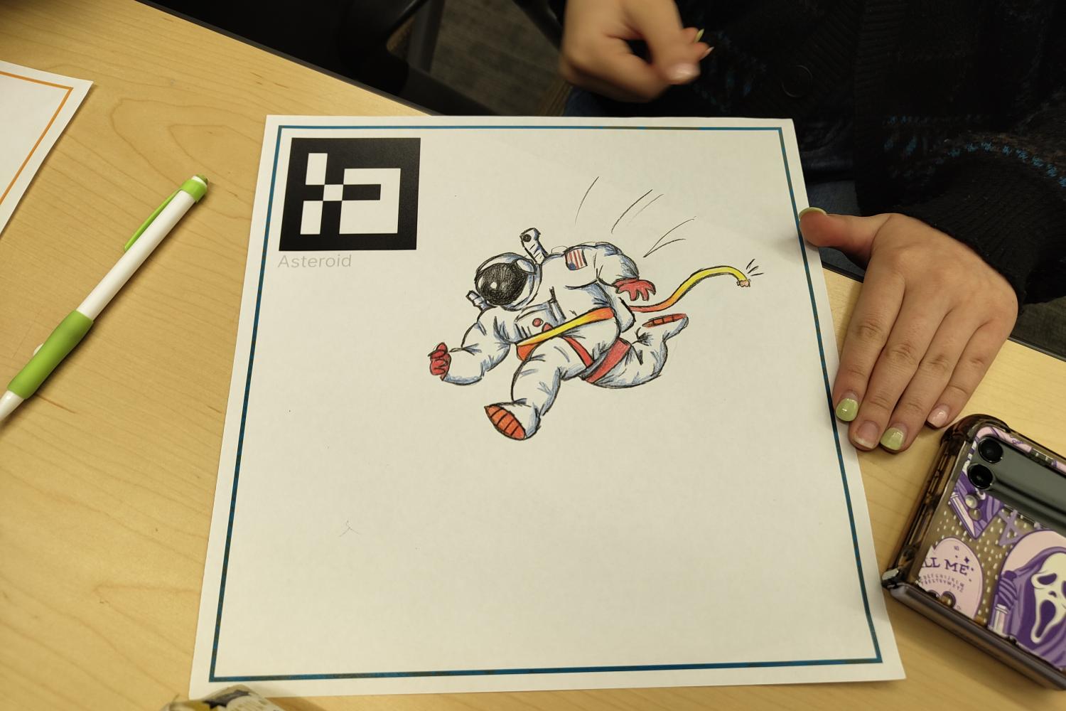Cartoon drawing of an astronaut on paper