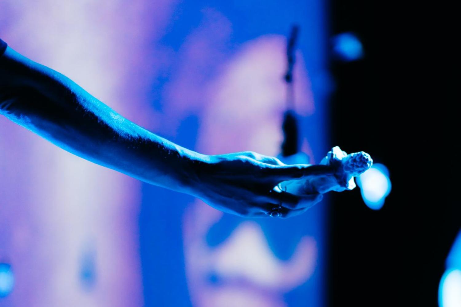 close up of arm holding a sculpture