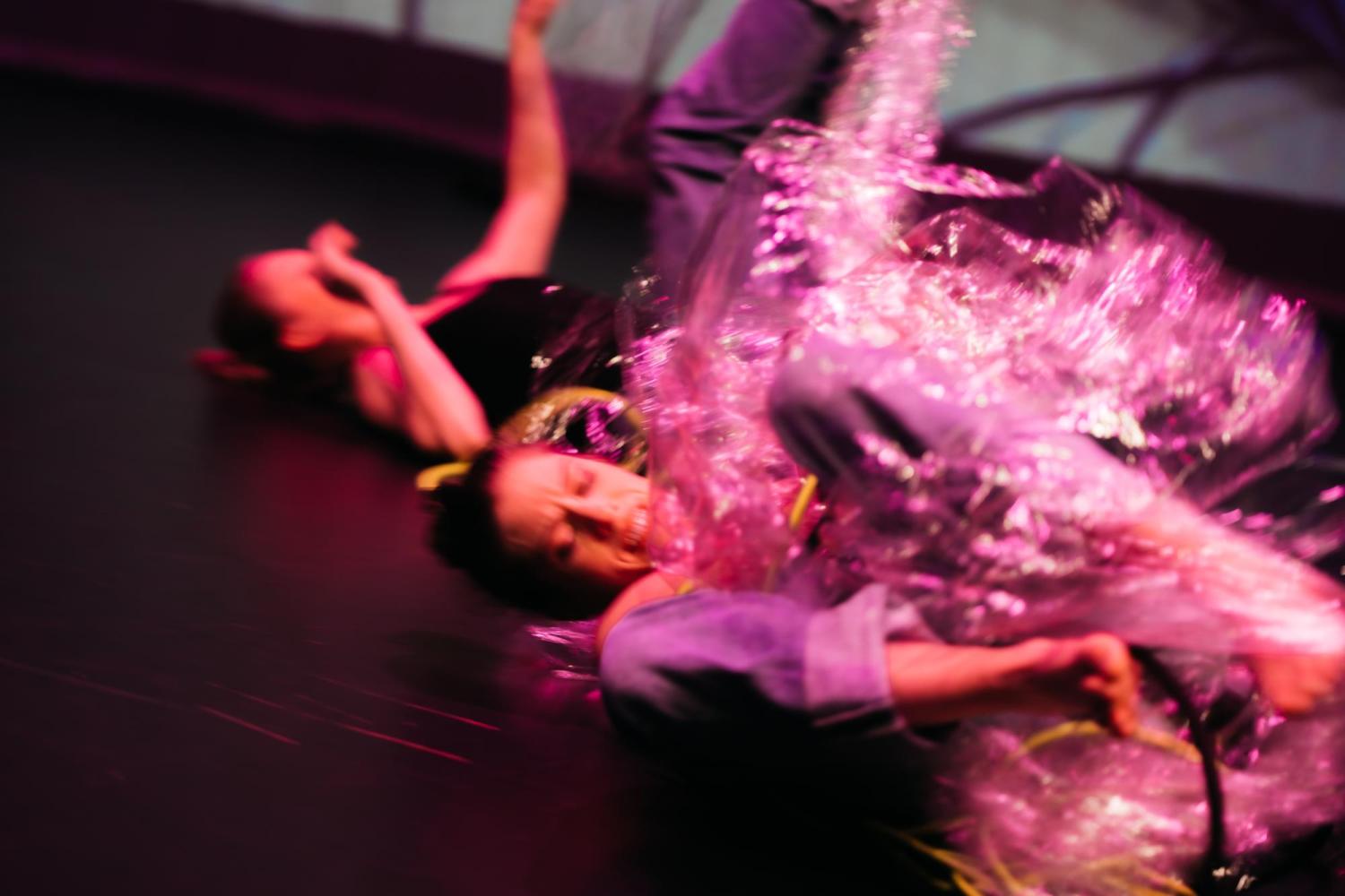 two dancers trying to escape from plastic