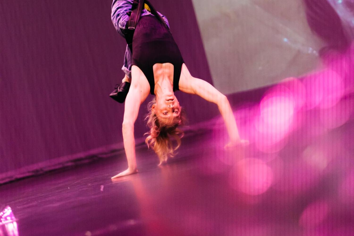 anna connected to a harness while upside down