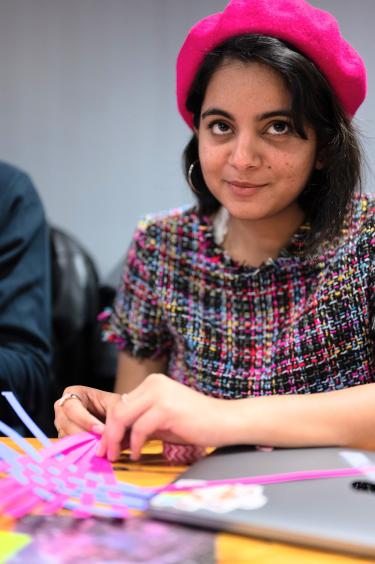 Student working on paper weaving project