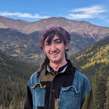 Caleb Loewengart picture in front of mountains