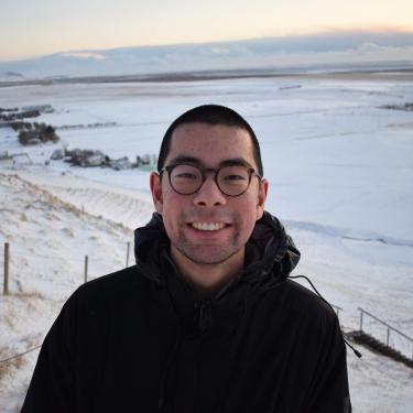 Derrek Chow with a snow scene behind him