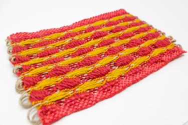 Red and yellow woven form by Etta Sandry