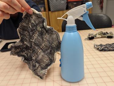 Woven form with water bottle by Kathryn Walters