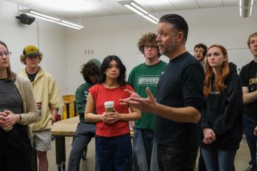 Zack Weaver teaches students in a classroom