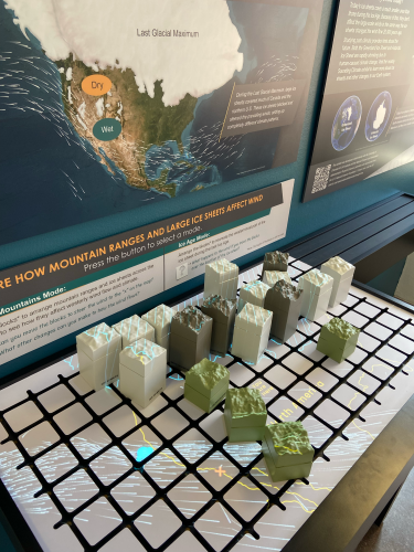 3d blocks of topography laid out on a grid with a projection on top